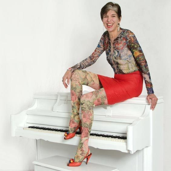 Piano player Marcia Ball repping her faux-tat sleeves - COURTESY