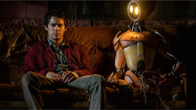 Joel (Dylan O'Brien) is dealing with the end of the world, the death of his parents and the loss of his love. But at least he has a companion robot to keep him company. - PARAMOUNT PICTURES