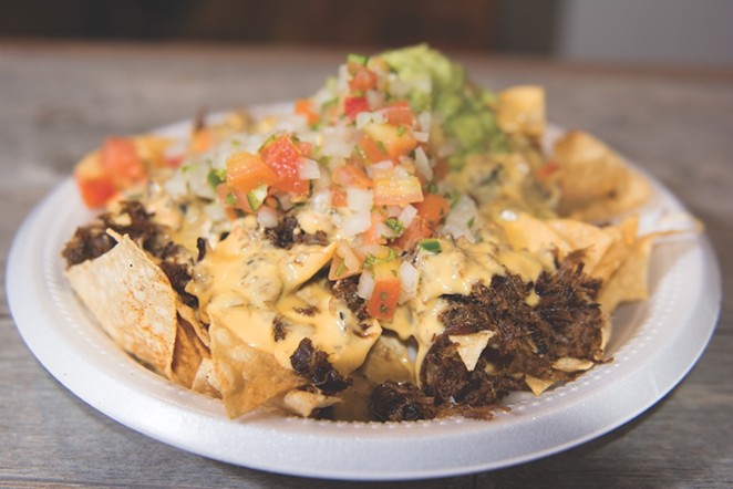 Share a pile of brisket nachos with the kids.