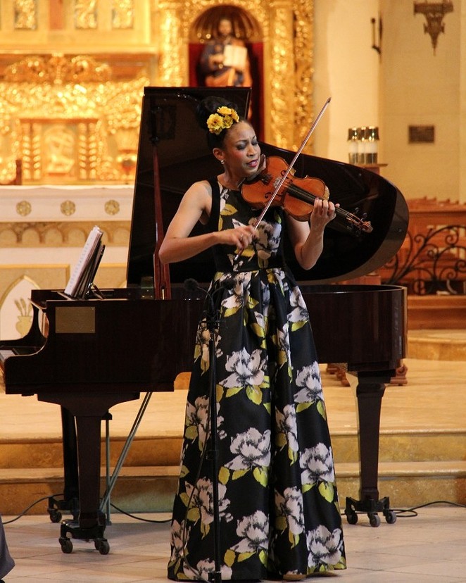 A violinist performs as part of one of MBAW's free concerts at the San Fernandro Cathedral. - COURTESY OF MUSICAL BRIDGES AROUND THE WORLD