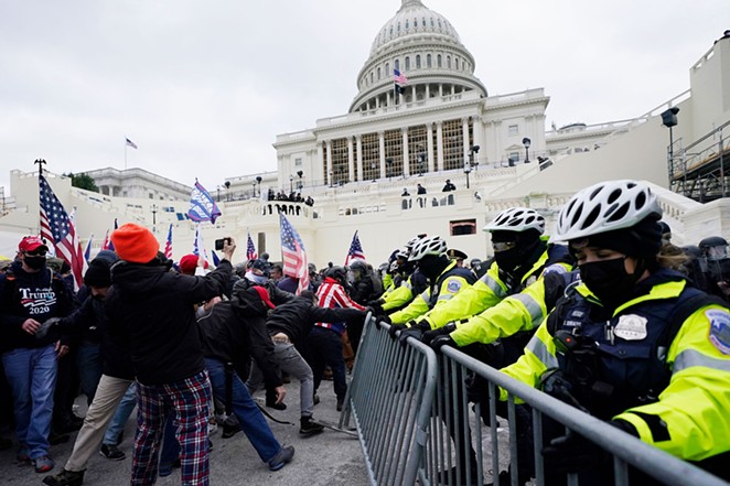 Insurrectionists tangle with police during the January 6 riot at the U.S. Capitol. - SHUTTERSTOCK