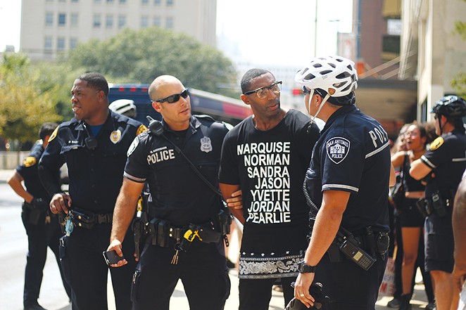 Black Lives Matter organizer Mike Lowe is shown being arrested last summer in the file photo. Mayor Ivy Taylor has invited him to join a task force on police accountability reform. Lowe criticized a collective-bargaining agreement passed by City Council Thursday for not including accountability reform. - Darcell Designs
