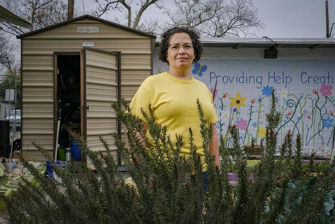 Jennifer Sierra tends to the St. Phocas Garden, growing an assortment of vegetables and herbs year-round to supplement a local food pantry — the only source of fresh produce for some of its clients. - CHRISTOPHER LEE / TEXAS TRIBUNE