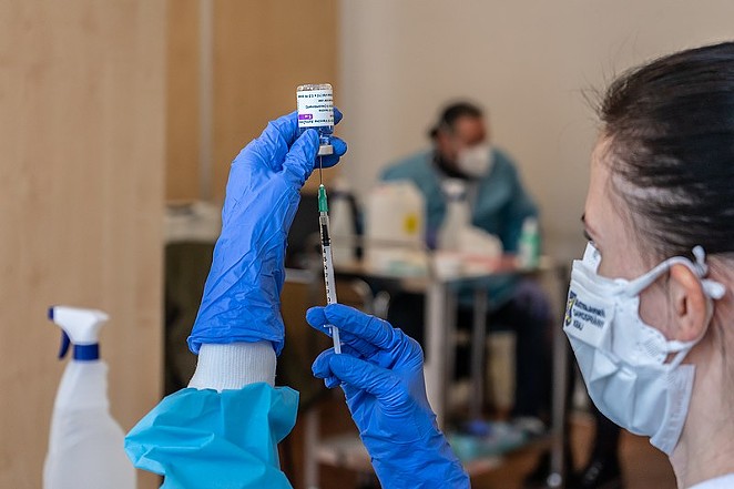 A health worker draws a syringe full of AstraZeneca's COVID-19 vaccine. - WIKIMEDIA COMMONS / BRATISLAVSKYSAMOSPRAVNYKRAJ