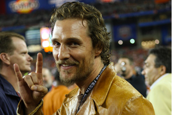 Matthew McConaughey flashes the hook 'em horns sign at a UT football game. - INSTAGRAM / WDPG SHARE