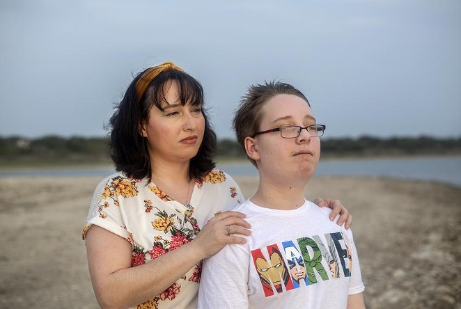 Trish and her 12-year-old son look out into the sunset at Canyon Lake on April 13, 2021. Trish earns too much to qualify for Medicaid in Texas but too little to afford her own health insurance. Her son does qualify for Medicaid. - MONTINIQUE MONROE / THE TEXAS TRIBUNE