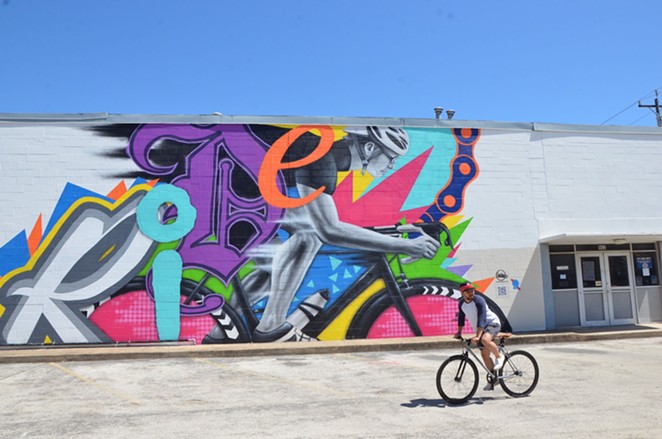 Local duo Los Otros celebrates the cycling community in the Pabst-sponsored mural Ride. - BRYAN RINDFUSS