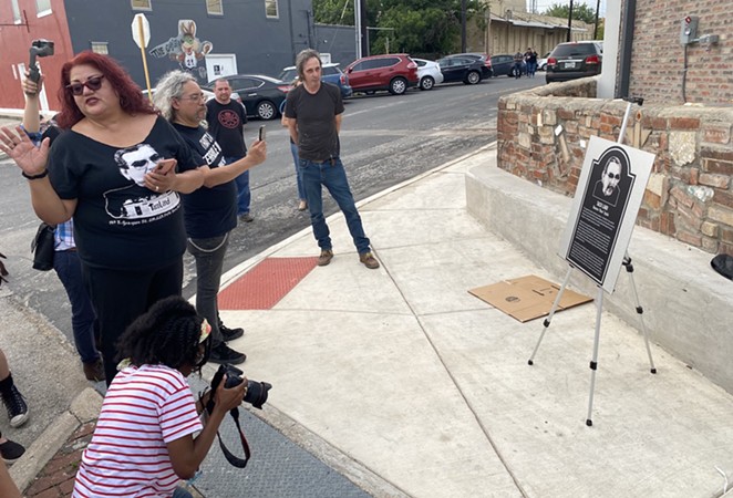 Bell Solloa (left) and Jeff Smith (right) show off a replica of the metal plaque that will hang at Velvet Taco. - SANFORD NOWLIN