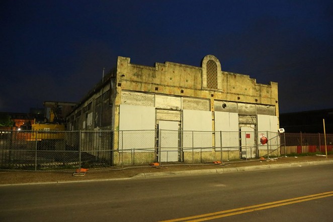 The Whitt building as it stands facing West Houston Street on the night of May 30. - SA HERON / BEN OLIVO