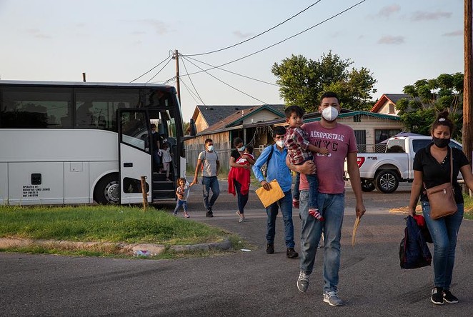 A group of migrants are dropped off at Our Lady of Guadalupe Catholic Church in Mission on Wednesday. - TEXAS TRIBUNE / JASON GARZA