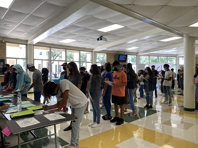 Students line up to register this week at NISD's Holmes High School. - Twitter / @NISD