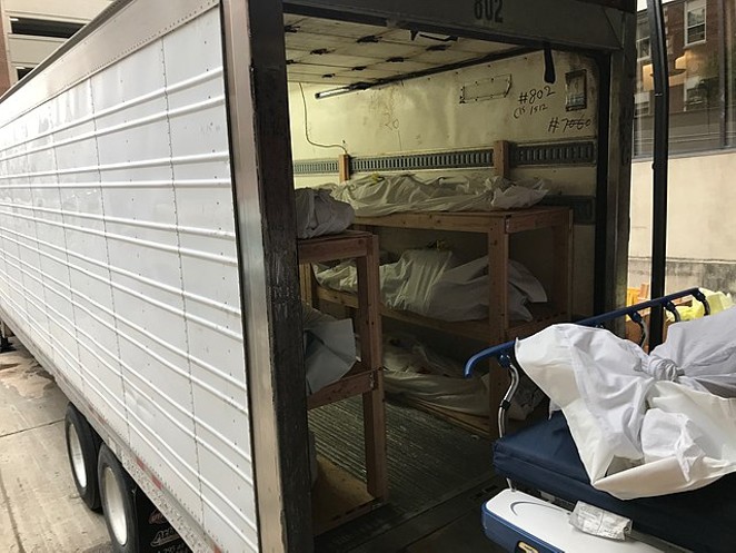 Bodies of COVID-19 fatalities are loaded into a mortuary trailer in New Jersey during April of last year. - WIKIMEDIA COMMONS /CREATIVE COMMONS ZERO, PUBLIC DOMAIN DEDICATION