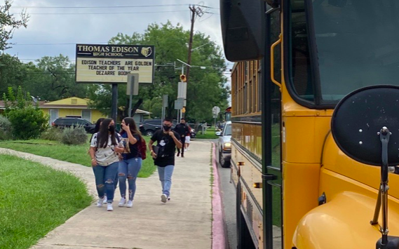 Masked students approach Thomas Edison High School. - FACEBOOK / SAN ANTONIO ISD