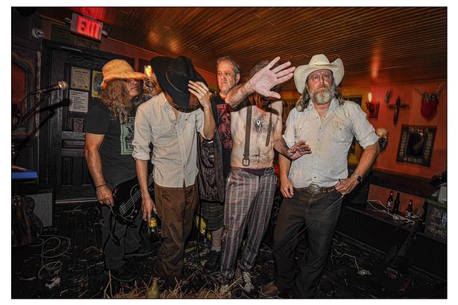 Hickoid Jeff Smith (second from right) hides his face as the band pauses for photo following a gig. - COURTESY PHOTO / RICHARD TOMCALA