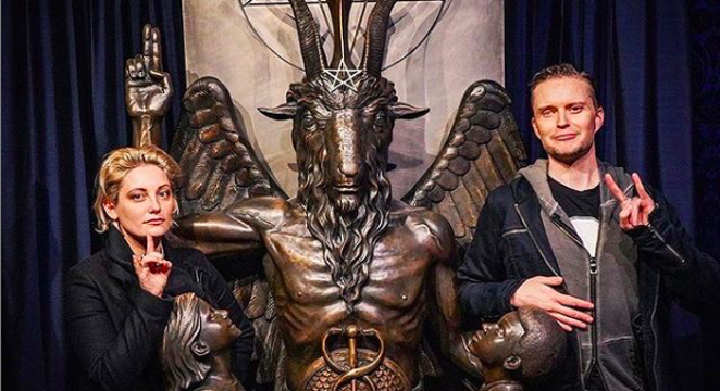 Temple of Satan co-founder Lucien Greaves (right) flashes the horns with a friend. - Instagram / @thesatanictemple