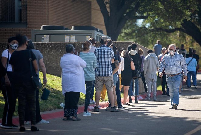 People wait in line to vote at Audelia Road Branch Library on the first day of early voting in Dallas on Oct. 13, 2020. - TEXAS TRIBUNE / MONTINIQUE MONROE