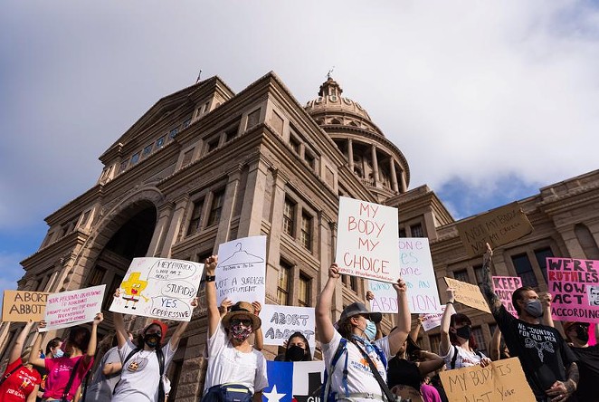 Protesters stand at the front steps of the state Capitol in opposition to Texas' abortion restrictions law on Oct. 2, 2021. - Texas Tribune / Michael Gonzalez