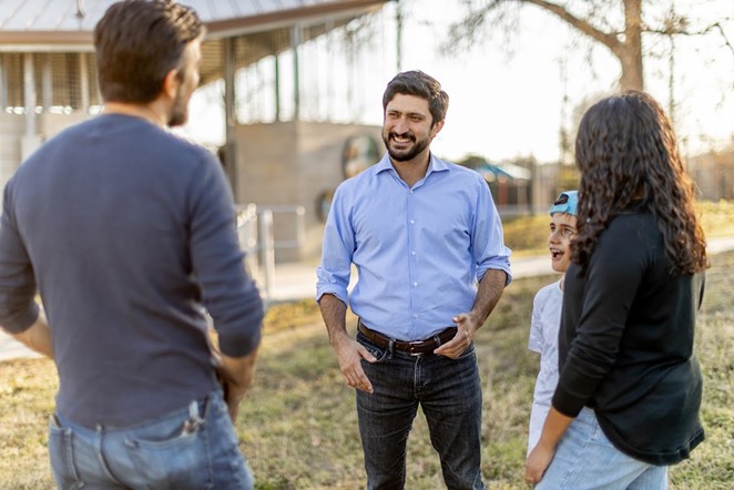 U.S. House candidate Greg Casar talks to potential voters. - COURTESY PHOTO / GREG CASAR