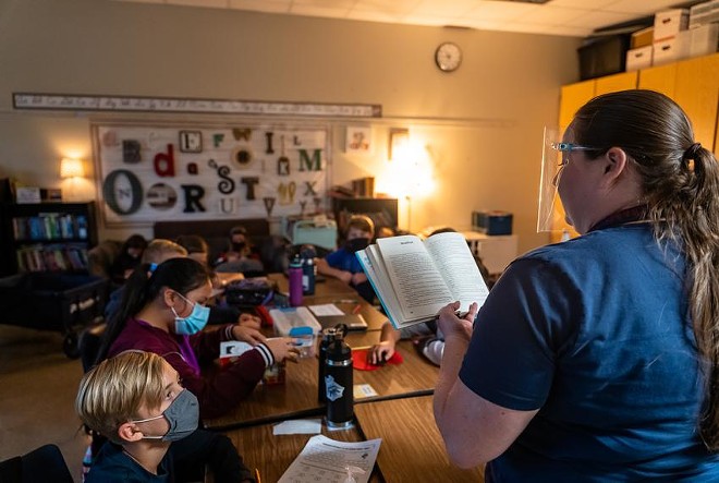 Teacher Melissa Perry reads to her fifth grade class at Jacob’s Well Elementary School in Wimberley on September 4, 2020. - Texas Tribune / Jordan Vonderhaar