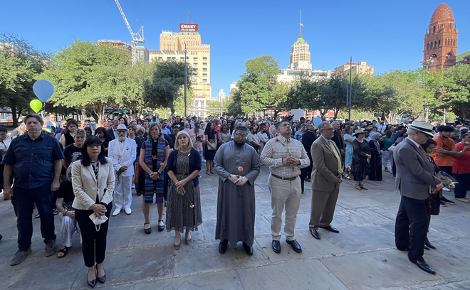 Religious leaders from San Antonio face the steps of the San Fernando Cathedral as the bells rang 21 times to honor each victim of the Robb Elementary School massacre. - Michael Karlis