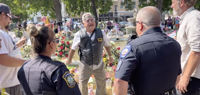 The man in the now-viral video confronts police at a memorial to victims of the school shooting. - TIKTOK / EDDIE_EL REGIO
