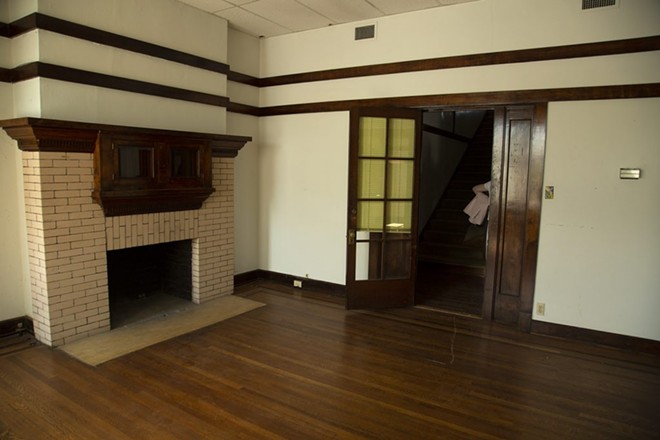 One of four fireplaces inside the Hughes House.  - SAN ANTONIO HERON / BEN OLIVO