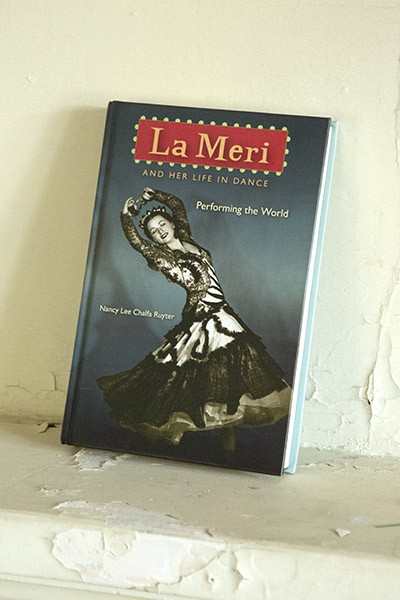 A biography of “La Meri,” the stage name for the famous dancer Russell Hughes, who grew up in the home, sits on a mantle. - SAN ANTONIO HERON / BEN OLIVO