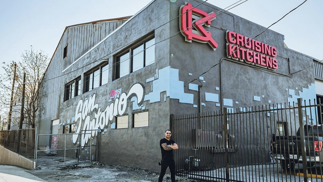 Cruising Kitchens CEO Cameron Davies poses in front of his shop at 314 Nolan St. - K. Lopez for Davies Entertainment