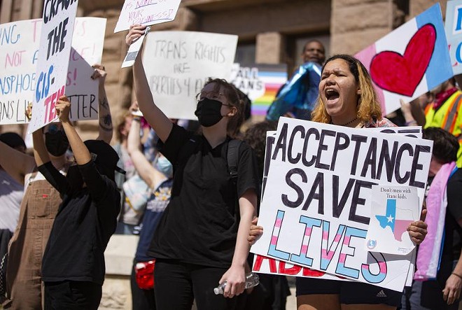 Naia Fulton-Jones chants in front of the Texas Capitol on Mar. 1 to protest for transgender kids’ rights. - Texas Tribune / Lauren Witte