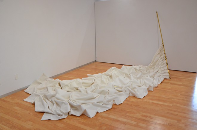 A 23-foot curtain dubbed Arctic Dreams anchors Karen Mahaffy’s Trinity exhibition “Objects of Absence.” - Bryan Rindfuss