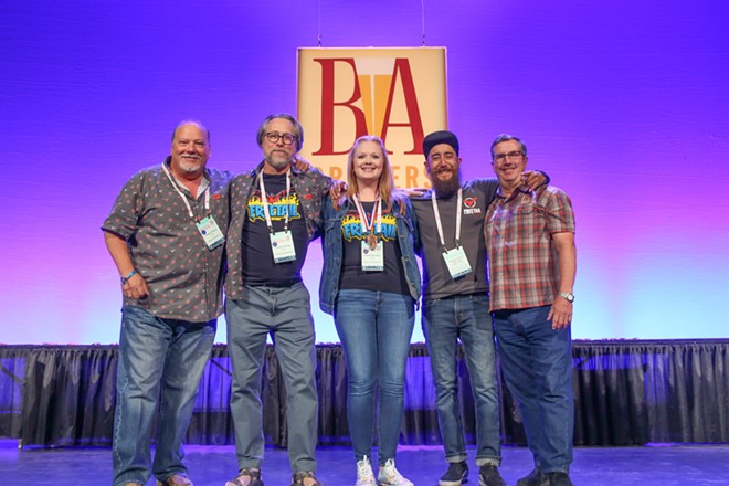 Freetail Brewing's crew accepts a bronze medal for its Bowie Bock. - Jeremy Banas