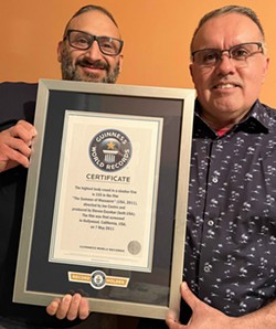 Joe Castro (left) and husband Steven Escobar show off their Guinness certificate.  - Courtesy Photo / Joe Castro