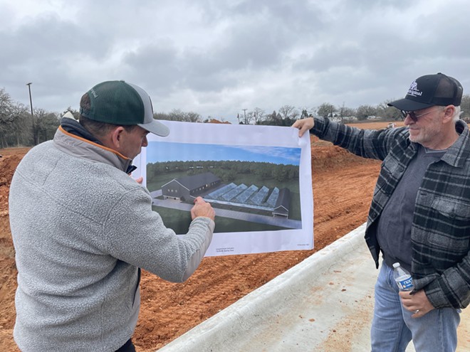 CEO Morris Denton, left, looks at plans for Texas Original Compassionate Cultivation’s growing facility. - Courtesy Photo / Texas Original Compassionate Cultivation
