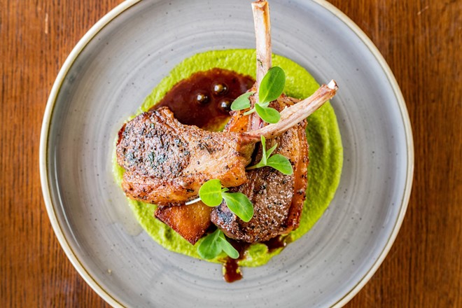 New seasonal menu items — such as this tomahawk pork chop — are now available at Hill Country eatery Antlers Lodge. - Courtesy Photo / Hyatt Regency Hill Country Resort & Spa