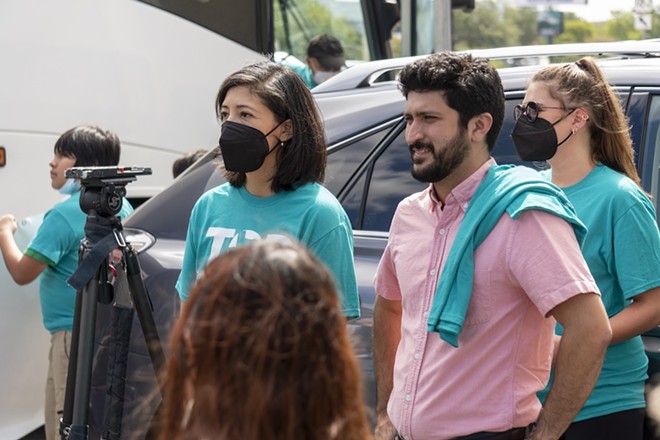 Greg Casar (in pink shirt) attends a protest on behalf of residents of a San Antonio apartment complex. - Courtesy Photo / Greg Casar