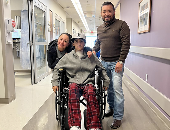 Erik Cantu (center) is photographed with his parents at University Hospital. - Courtesy Photo / Cantu Family