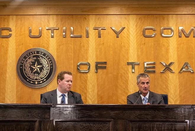 From left: Peter Lake, chair of the Public Utility Commission of Texas, and Brad Jones, then-interim president and CEO of the Electric Reliability Council of Texas, speak at a May 17 press conference about the state power grid. - Texas Tribune / Jordan Vonderhaar