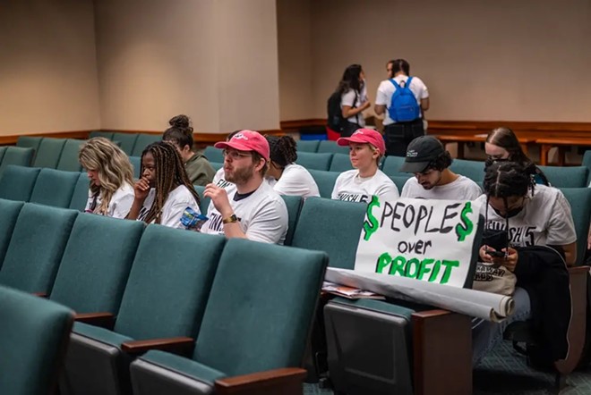 Unable to snag seats in the House gallery on the Legislature’s opening day, the teens gather in a committee room to watch the session begin. - Texas Tribune / Sergio Flores