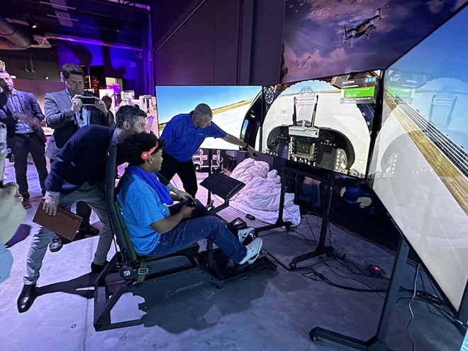 John Barnes, a senior at South San Antonio High School, tries out the new Boeing Aerospace Adventure flight simulator at the San Antonio Museum of Science and Technology at the recently renamed Boeing Center.  -Michael Karlis
