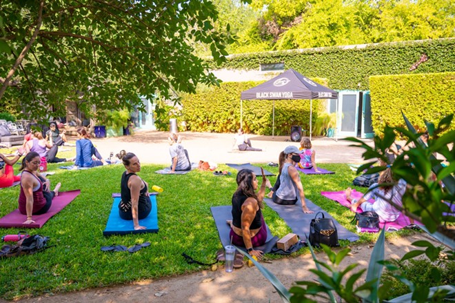 The Good Kind holds weekly yoga sessions in its garden. - Courtesy Photo / The Good Kind