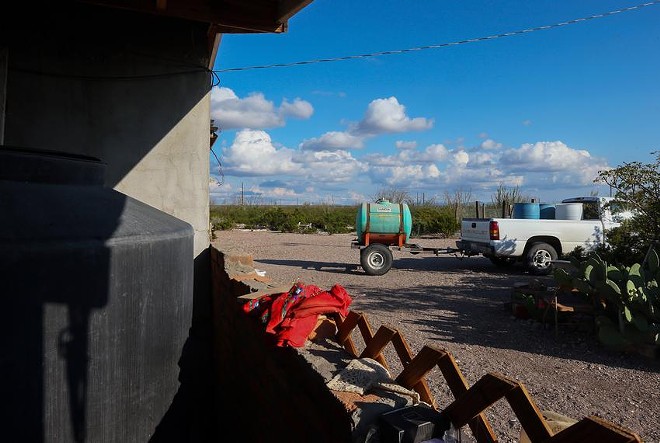 A portable water tank at a colonia at Las Pampas in Far West Texas on Oct. 21, 2014. Black and Hispanic Texans and those living in some of the state’s poorest neighborhoods said in a new survey they don’t trust their drinking water. - Texas Tribune / Jennifer Whitney