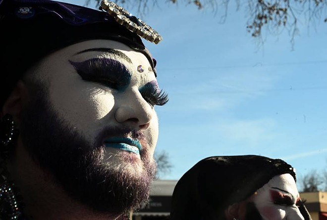 Counter-protesters join drag show supporters in makeup and robes outside BuzzBrews on Jan. 14. - Texas Tribune / Leila Saidane