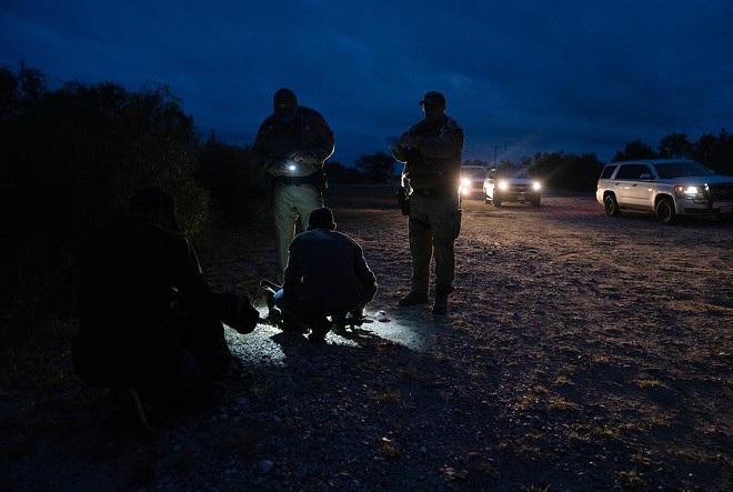 Department of Public Safety agents arrest an undocumented migrant after he was caught on private property as part of Operation Lone Star in Kinney County near Brackettville on Nov. 9, 2021. - ProPublica / Texas Tribune / Verónica G. Cárdenas