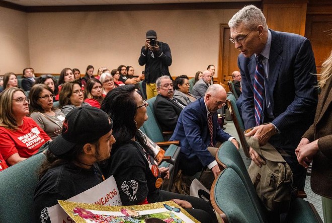 Velma Duran, the sister of Irma Garcia, one of the two teachers killed in the Robb Elementary school shooting, confronts Texas Department of Public Safety Director Steve McCraw after he finished testifying to the Homeland Security & Public Safety committee hearing at the state Capitol in Austin on Feb. 28, 2023. “They stood around and enabled the shooter to obliterate my sister. You couldn’t recognize her,” Duran said to McCraw. “Look at me!” - Texas Tribune / Evan L'Roy