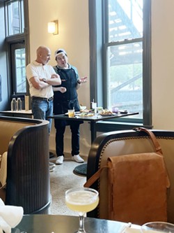 Owner Chris Hill and chef Ben Cachila discuss a menu item at the Tokyo Cowboy media preview. - Nina Rangel