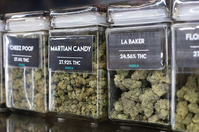 Cannabis varieties on display in a dispensary. - Braden McMakin