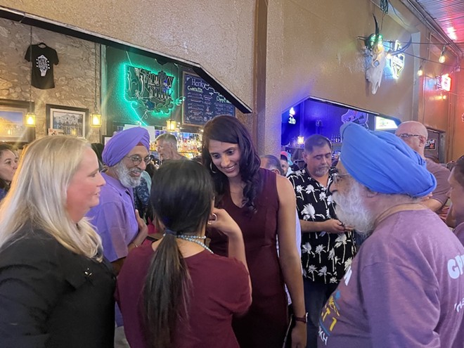 Newly elected District 1 City Councilwoman Sukh Kaur thanks supporters during her watch party at El Honky Tonk on Saturday. - Brandon Rodriguez
