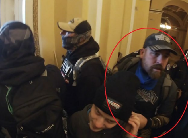 This image from an FBI affidavit purports to show Brandon Lee Bradshaw (circled) with rioters in the Senate Wing of U.S. Capitol. - FBI image