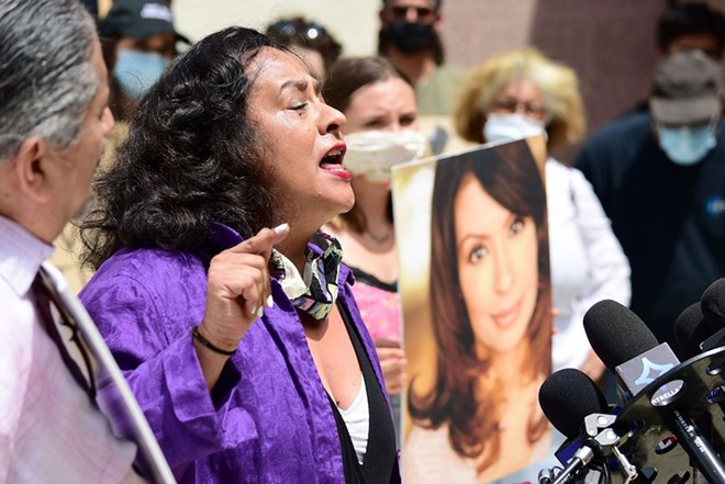 Actress Ingrid Oliu speaks at a press conference demanding justice for her Stand and Deliver co-star Vanessa Marquez. - Courtesy Photo / Cyndy Fujikawa