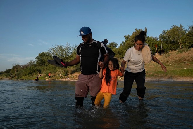 Alexander, 37; his wife Jocelyn, 30; and their 6-year old daughter cross the Rio Grande from Piedras Negras, Mexico, to turn themselves in to U.S. authorities. - Texas Tribune / Verónica G. Cárdenas